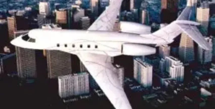 Location jet privé : Challenger 300 survolant des gratte-ciel.