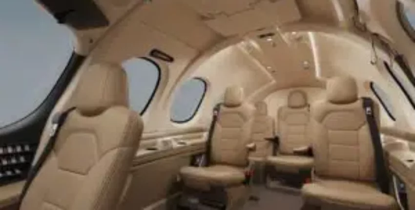 location de jet privé - intérieur luxueux en cuir beige, fenêtres larges